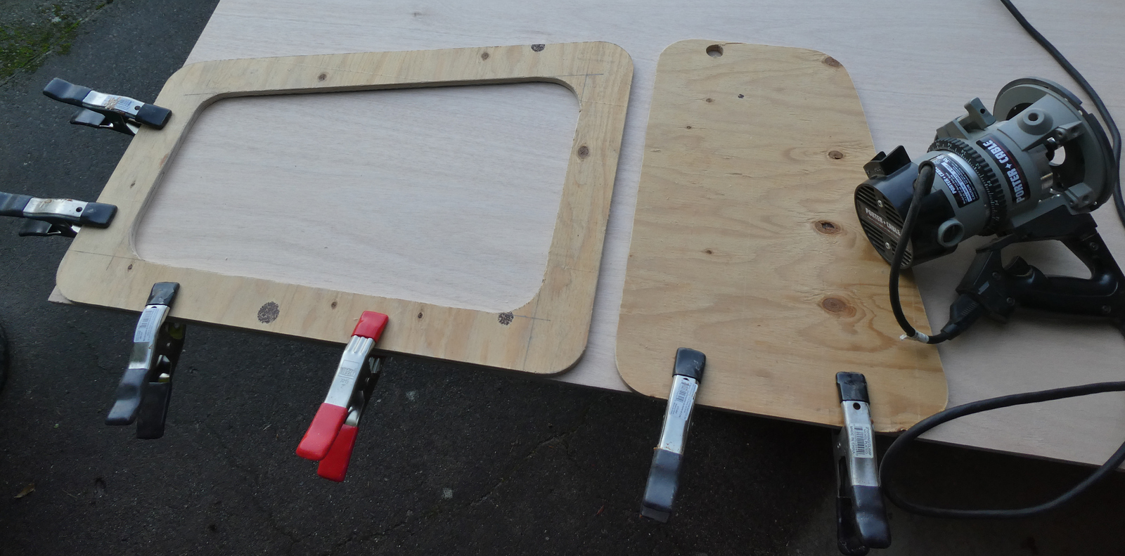 router templates clamped on fresh plywood