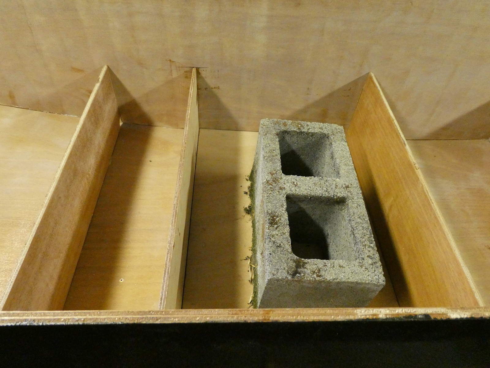 A mossy concrete block holds down the bottom of the footwell while the doubler glues in