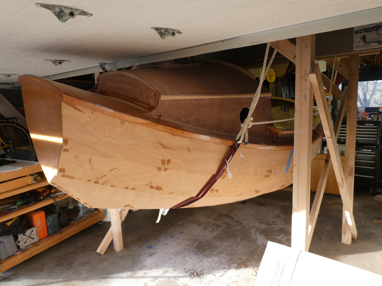 With the garage door open you can see how close I am to running out of room when the boat was raised up high enough to drag the build cradle out